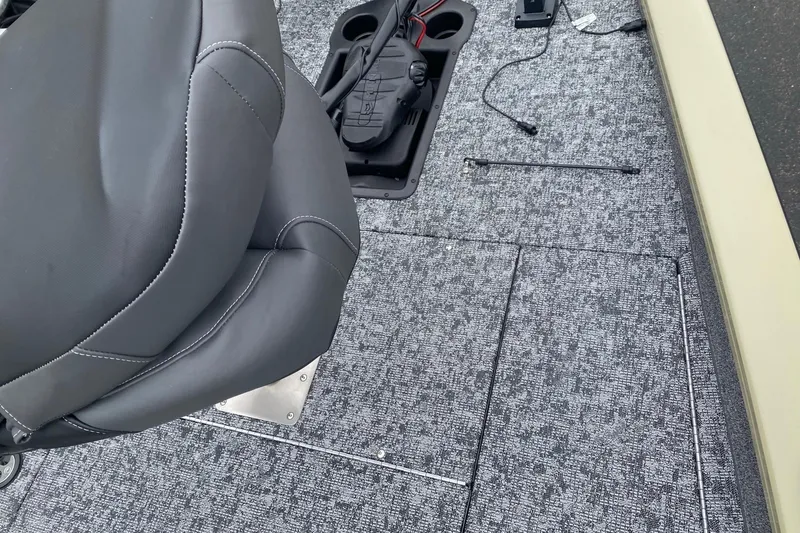 Slide: The Image of 2026 Tracker Pro Team 175 boat interior with gray seat and textured flooring. - 4