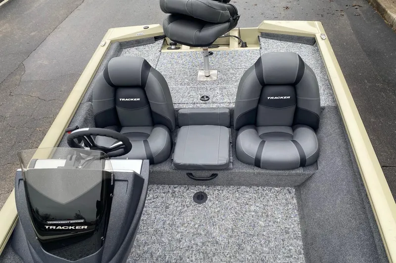 Slide: The Image of 2026 Tracker Pro Team 175 boat interior with gray seating and steering console. - 6