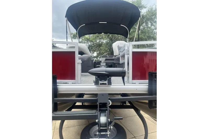 Slide: The Image of 2026 Sun Tracker Bass Buggy 18 DLX pontoon boat with canopy and seating. - 8