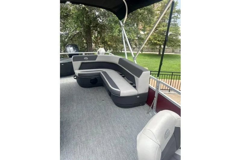 Slide: The Image of 2026 Sun Tracker Bass Buggy 18 DLX pontoon boat with spacious seating and canopy. - 5