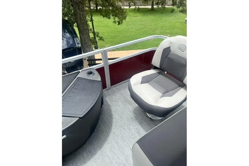 Slide: The Image of 2026 Sun Tracker Bass Buggy 18 DLX interior with comfortable seating and sleek design. - 3