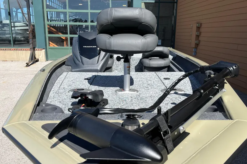 Slide: The Image of 2026 Tracker Pro Team 175 Crappie Edition fishing boat with seating and trolling motor. - 2