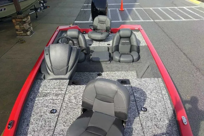 Slide: The Image of 2026 Tracker Pro Team 195 boat interior with gray seating and red accents. - 5