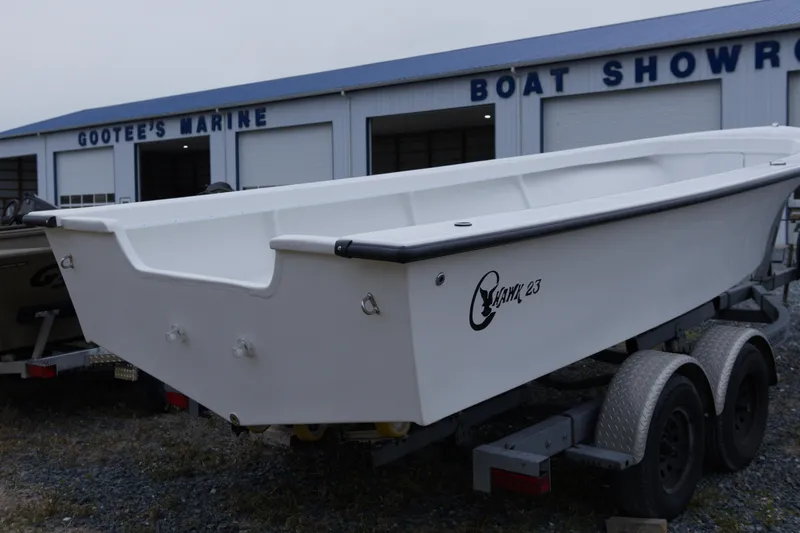 Slide: The Image of 2026 C-Hawk 23 Commercial boat on trailer at Gootee's Marine showroom. - 2