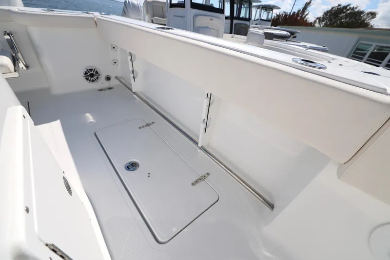 Slide: The Image of 2026 Sea Hunt Gamefish 27 Forward Seating boat interior with storage and seating. - 11
