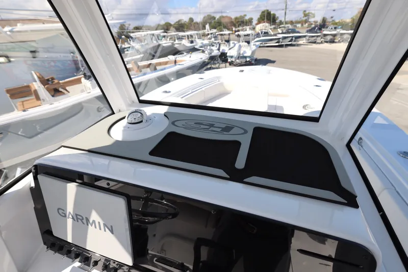 Slide: The Image of 2026 Sea Hunt Gamefish 27 Forward Seating boat interior with Garmin navigation system. - 12