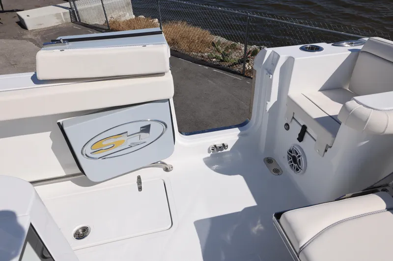 Slide: The Image of 2026 Sea Hunt Gamefish 27 boat interior with seating and storage features. - 13