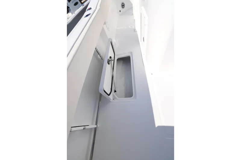 Slide: The Image of 2026 Sea Hunt Gamefish 27 Forward Seating boat interior storage compartment. - 17