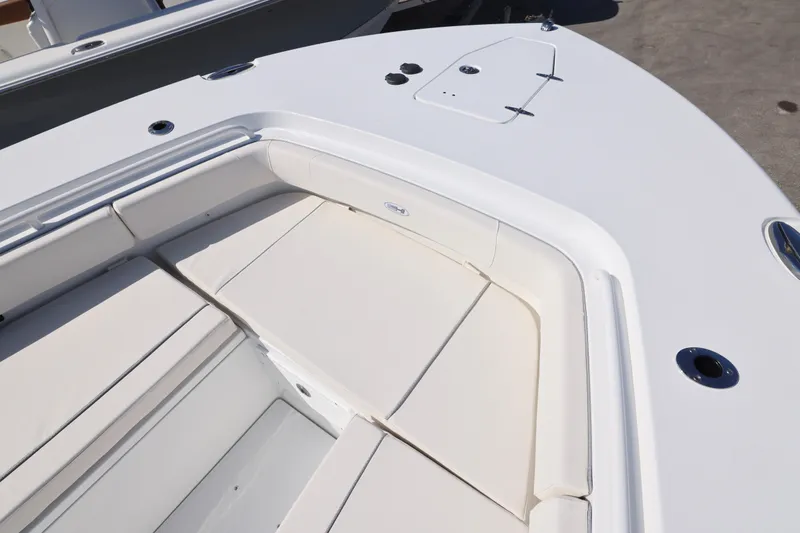 Slide: The Image of 2026 Sea Hunt Gamefish 27 Forward Seating, featuring spacious white cushioned bow area. - 25