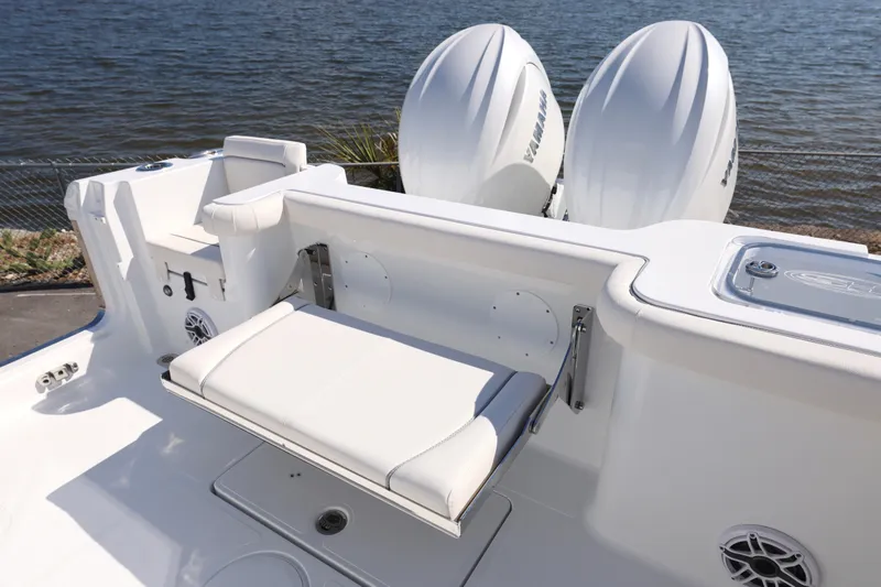 Slide: The Image of 2026 Sea Hunt Gamefish 27 boat with forward seating and dual Yamaha engines. - 3