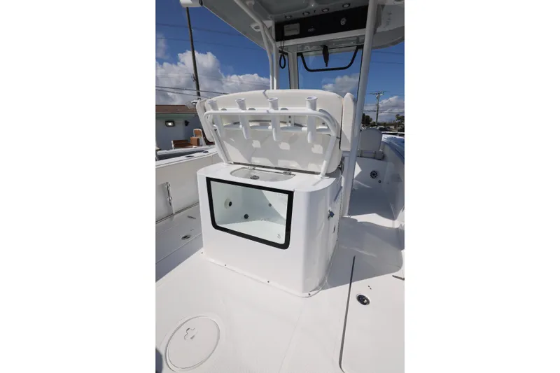 Slide: The Image of 2026 Sea Hunt Gamefish 27 boat interior with forward seating and storage compartment. - 4