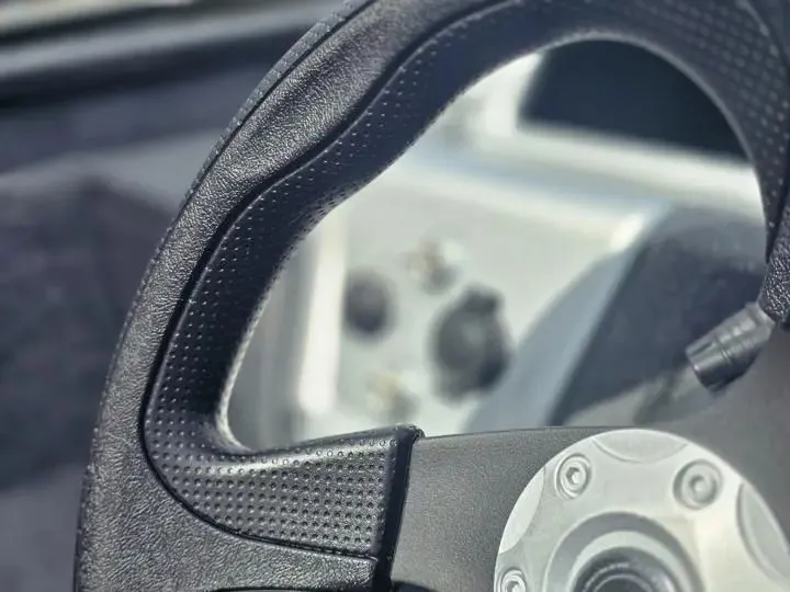 Slide: The Image of Close-up of a Tracker Pro Team 175 boat steering wheel, 2026 model. - 15