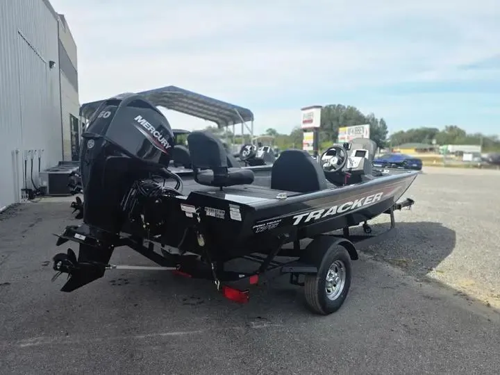 Slide: The Image of 2026 Tracker Pro Team 175 boat with Mercury engine on parking lot. - 7