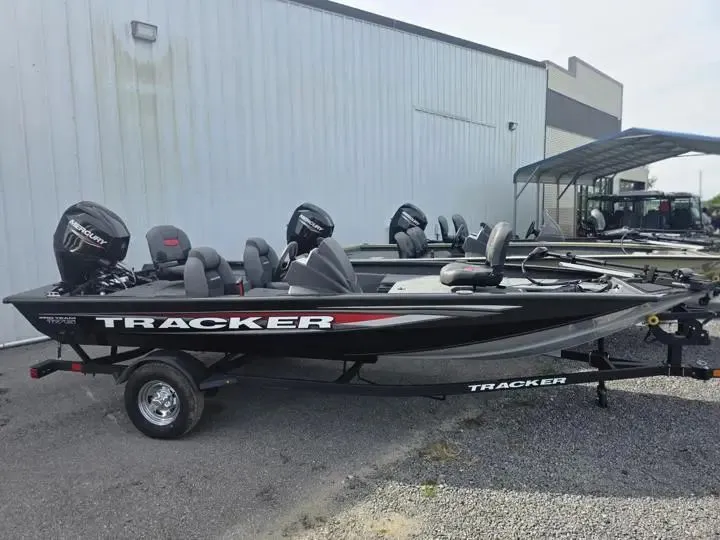 Slide: The Image of 2026 Tracker Pro Team 175 boat on trailer outside building. - 8
