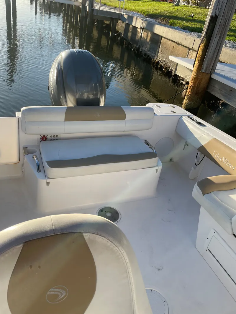 Slide: The Image of Interior of a 2016 Edgewater 205CX Crossover boat at the dock. - 11