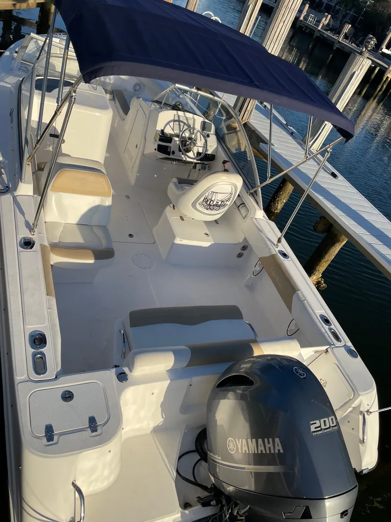 Slide: The Image of 2016 Edgewater 205CX Crossover boat with Yamaha engine at dock. - 6