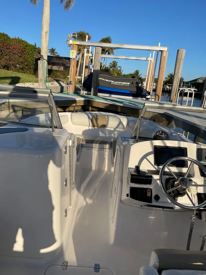 Slide: The Image of Interior view of a 2016 Edgewater 205CX Crossover boat at dock. - 8
