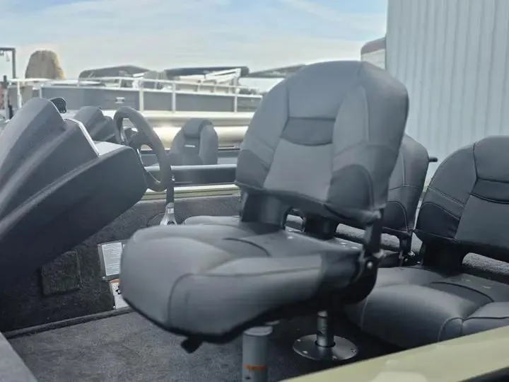 Slide: The Image of 2026 Tracker Pro Team 175 Crappie Edition boat seats and steering. - 10