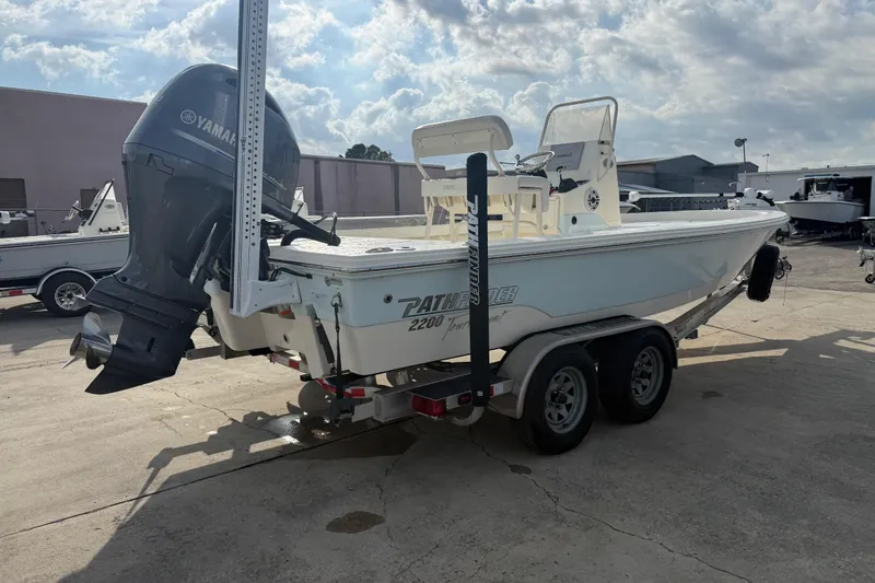 Slide: The Image of 2015 Pathfinder 2200 Tournament Edition boat on trailer with Yamaha outboard motor. - 13