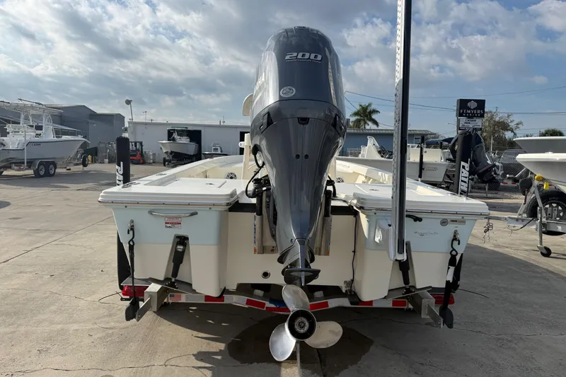 Slide: The Image of 2015 Pathfinder 2200 Tournament Edition boat with Yamaha 200 engine, parked outdoors. - 15