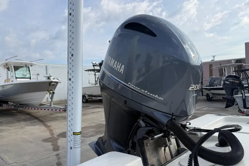 Slide: The Image of 2015 Pathfinder 2200 Tournament Edition with Yamaha 200 outboard motor in a boatyard. - 3