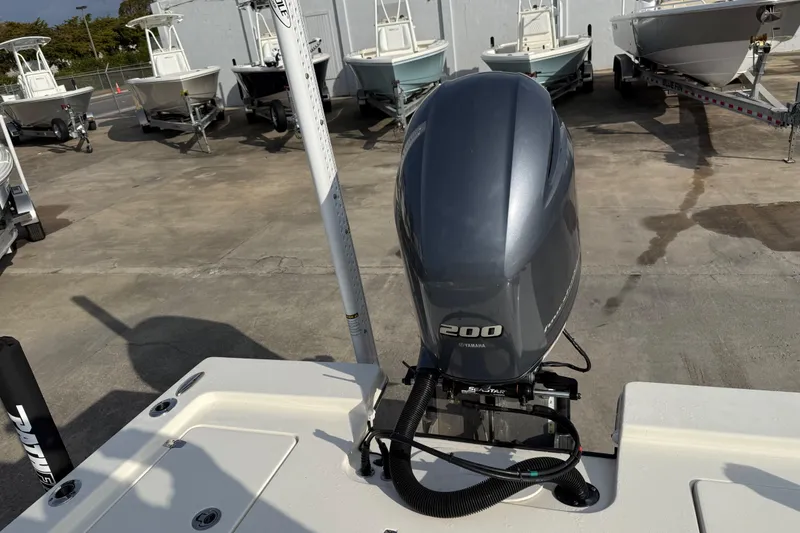 Slide: The Image of 2015 Pathfinder 2200 Tournament Edition boat with Yamaha 200 engine in a marina. - 7