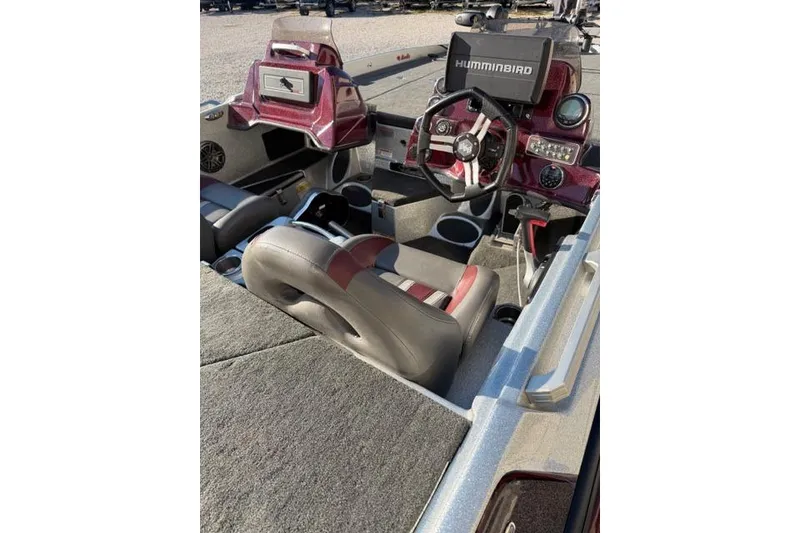 Slide: The Image of 2021 Bass Cat Lynx boat interior with steering wheel and Humminbird electronics. - 6