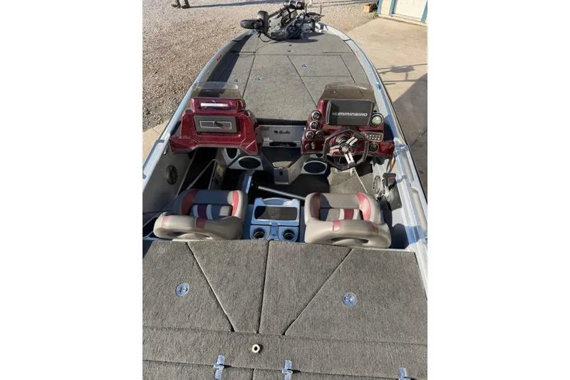 Slide: The Image of 2021 Bass Cat Lynx boat interior with dual seats and advanced dashboard controls. - 9