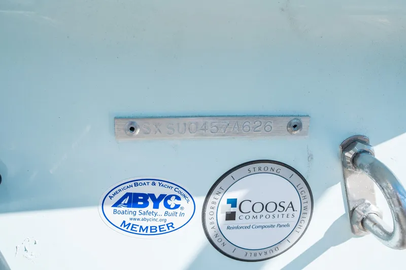 Slide: The Image of Sea Hunt Ultra 229 boat with ABYC and Coosa Composites stickers. - 24
