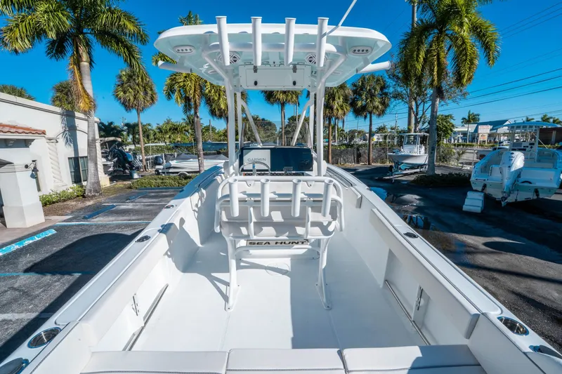 Slide: The Image of Sea Hunt Ultra 229 boat, 2026 model, in sunny setting. - 8