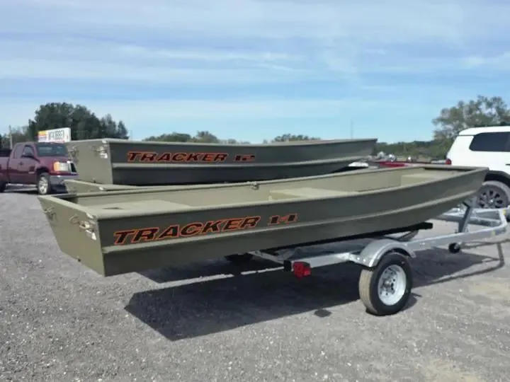 Slide: The Image of 2026 Tracker Grizzly 14 Jon boats on trailer outdoors. - 7
