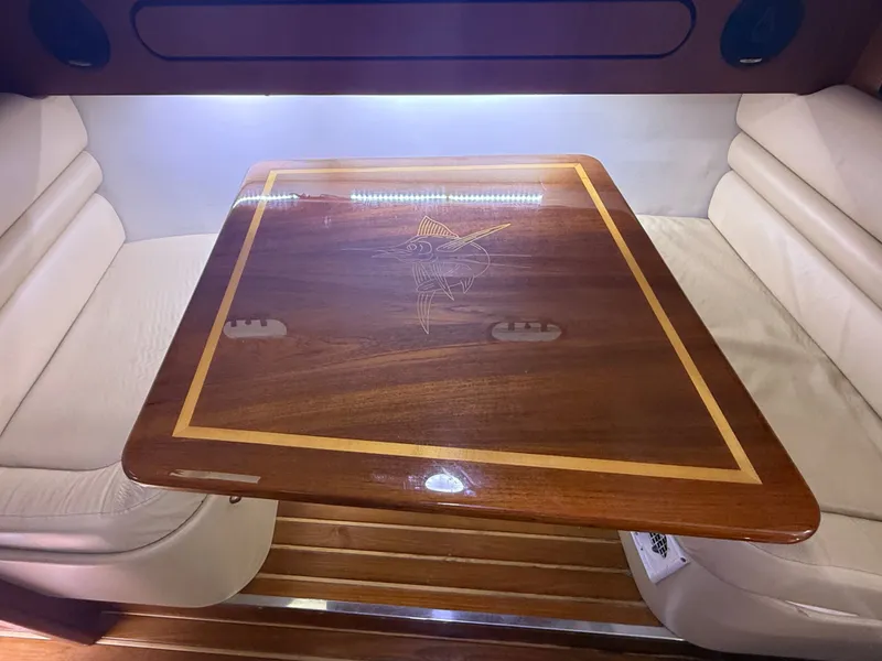 Slide: The Image of Wooden table with fish engraving in 2003 Pursuit 3400 Express. - 10