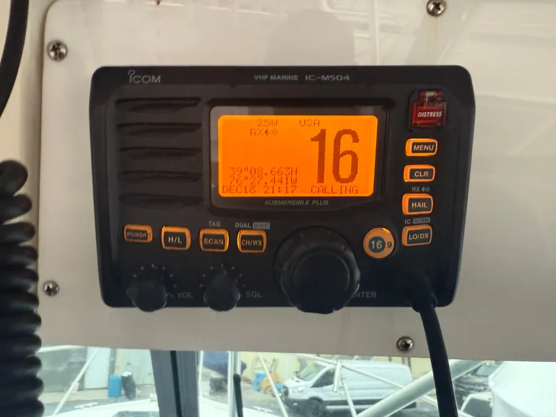 Slide: The Image of ICOM VHF marine radio on Pursuit 3400 Express, channel 16. - 25