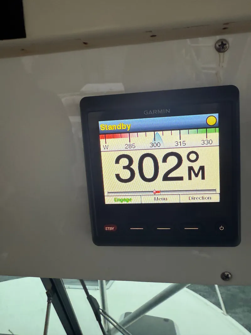 Slide: The Image of Garmin display on Pursuit 3400 Express boat, heading 302 degrees. - 26