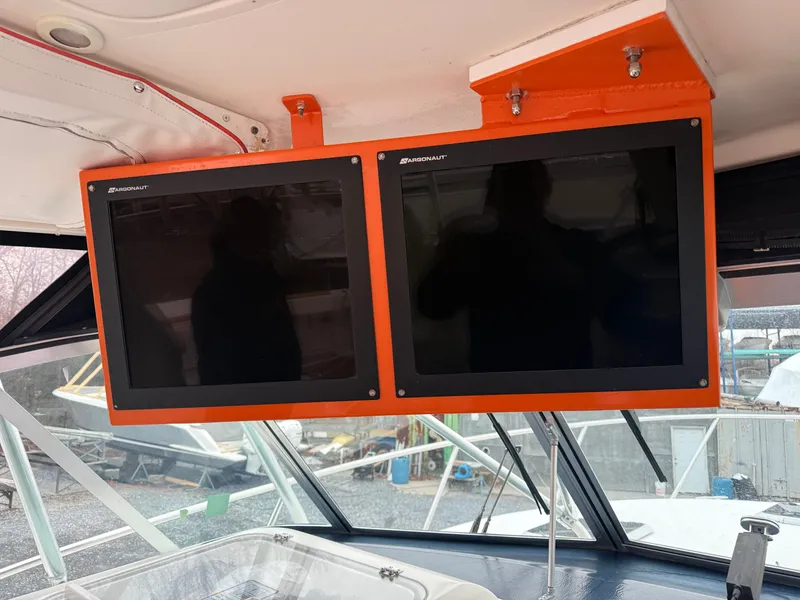 Slide: The Image of Two monitors on a 2003 Pursuit 3400 Express boat. - 28