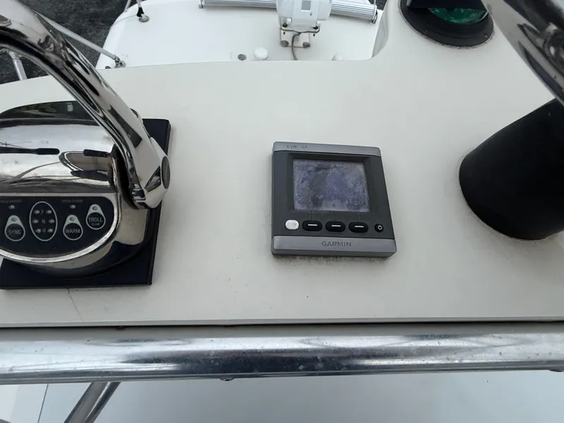 Slide: The Image of Garmin device on dashboard of a 2003 Pursuit 3400 Express boat. - 37