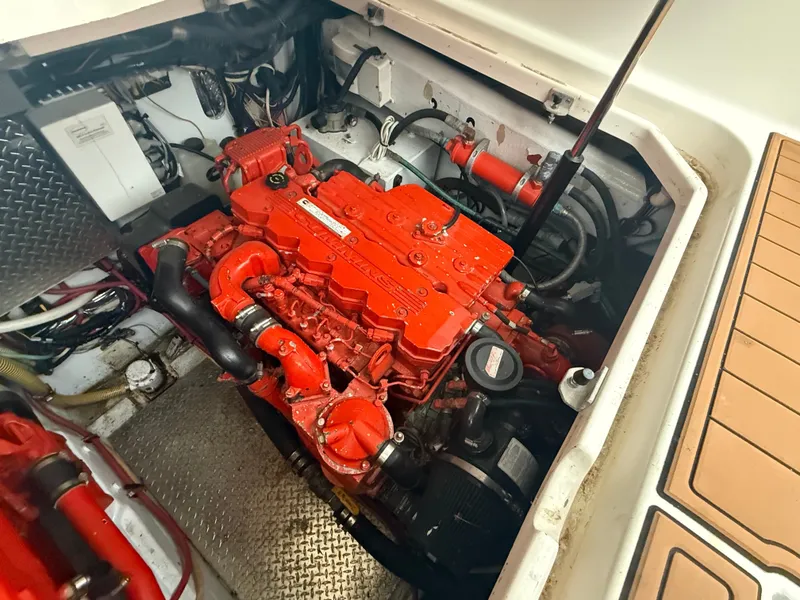 Slide: The Image of Engine compartment of a 2003 Pursuit 3400 Express boat with red engine. - 4