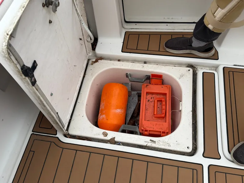 Slide: The Image of Storage compartment on a 2003 Pursuit 3400 Express boat. - 40