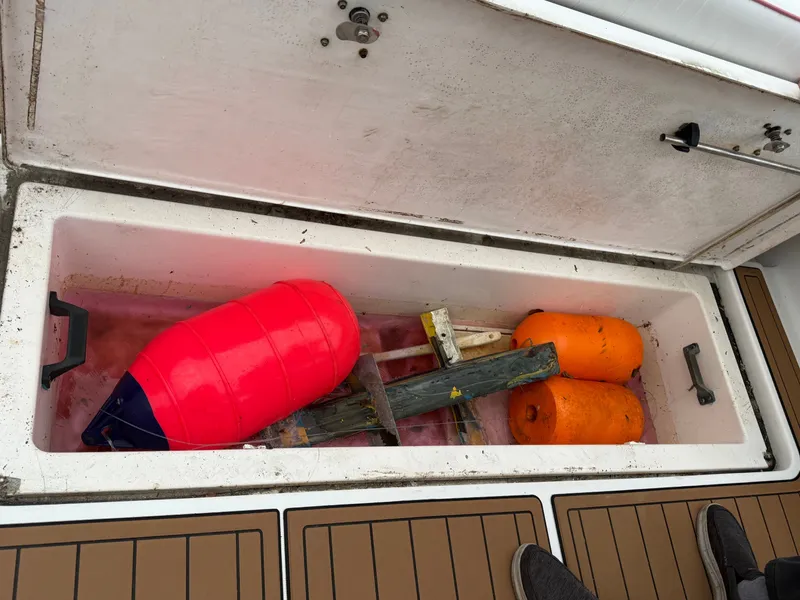 Slide: The Image of Storage compartment in Pursuit 3400 Express boat with buoys, 2003 model. - 41
