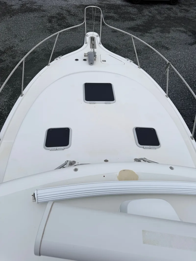 Slide: The Image of Deck of a 2003 Pursuit 3400 Express boat with hatches. - 42