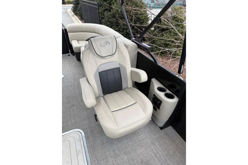 Slide: The Image of 2021 Barletta C22QC boat interior with luxurious beige seating and cup holders. - 16