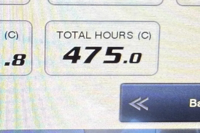 Slide: The Image of 2019 Pursuit OS 355 Offshore boat interior with helm, seating, and modern controls. - 16