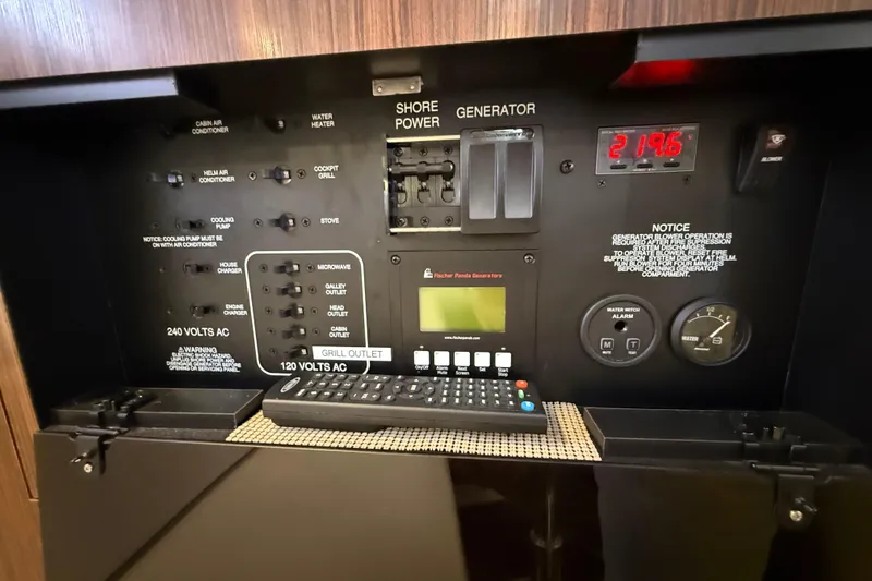 Slide: The Image of Open refrigerator inside 2019 Pursuit OS 355 Offshore boat, showcasing interior shelves. - 30