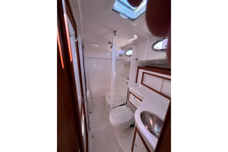 Slide: The Image of 2017 Back Cove 37 yacht bathroom with shower, sink, and toilet. - 10