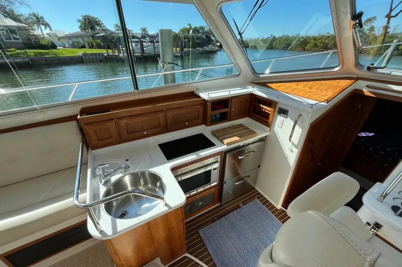 Slide: The Image of Luxurious 2017 Back Cove 37 yacht interior with modern kitchen and scenic water view. - 11