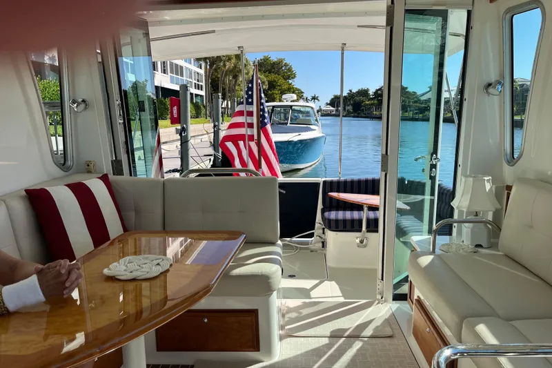 Slide: The Image of Interior of a 2017 Back Cove 37 yacht with elegant seating and waterfront view. - 8