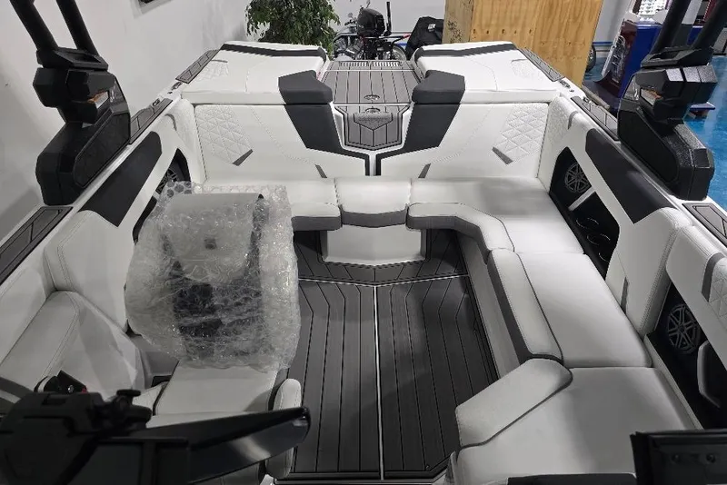 Slide: The Image of 2024 Nautique Super Air Nautique GS20 interior with luxurious seating and modern design. - 12