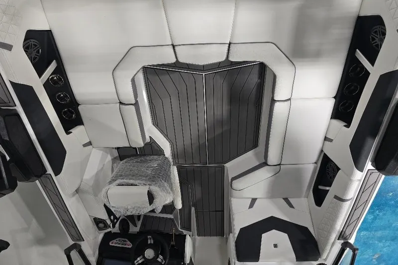 Slide: The Image of 2024 Nautique Super Air Nautique GS20 interior with sleek seating and modern design. - 16