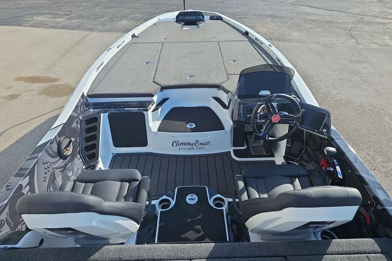 Slide: The Image of 2025 iKon LX21 boat interior with modern seating and advanced dashboard controls. - 16