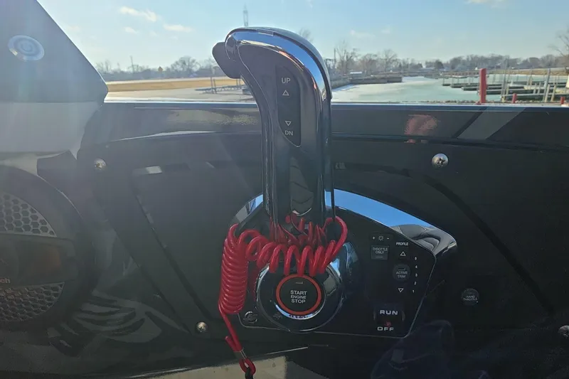 Slide: The Image of Boat throttle control panel with start button, red safety cord, and iKon LX21 model, 2025. - 18